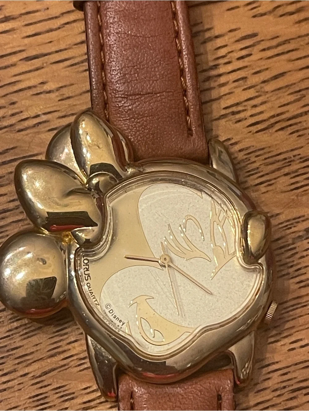 Vintage Lorus Minnie Mouse character watch featuring a distinct gold-tone Minnie